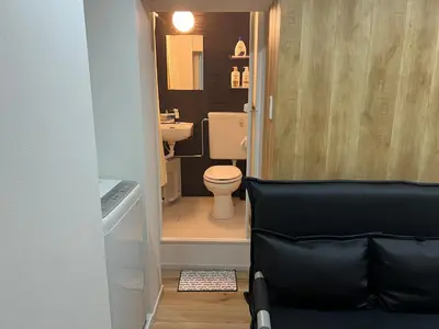a small bathroom with a toilet and a sink at Ikebukuro Area 45 NishiikeApartment in Tokyo
