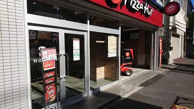 a store front with the doors open on a street at ASAHI-Entire building reserved in Tokyo