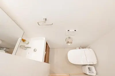 a small bathroom with a toilet and a sink at 67 Apt Kinshicho in Tokyo