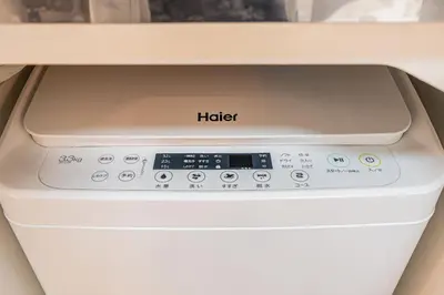 a washing machine with a hello sign on it at 67 Apt Kinshicho in Tokyo