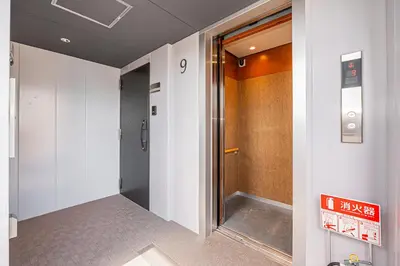 a hallway with a door in a building at 67 Apt Kinshicho in Tokyo