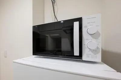 a microwave oven sitting on top of a shelf at M S I Kagurazaka in Tokyo