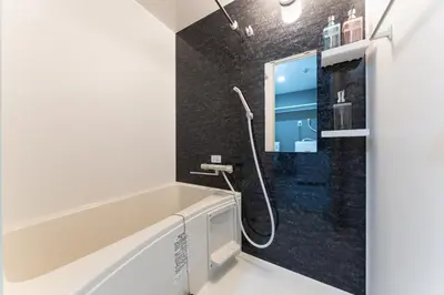 a bathroom with a shower and a sink at Omotenashi HOTEL Asakusa in Tokyo
