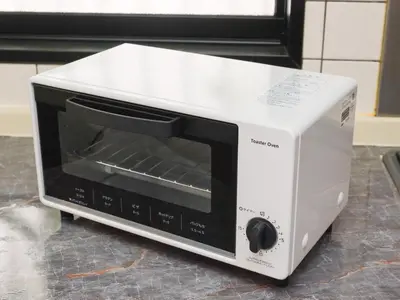 a microwave oven sitting on top of a counter at Comfort HASUNUMA in Tokyo