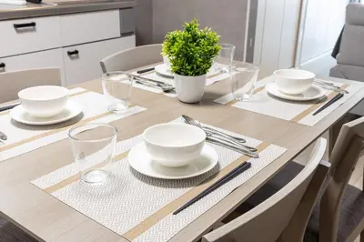 a dining room table with plates and glasses on it at Takakou building in Tokyo