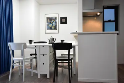 a kitchen with a white counter and stools at LANG - Vacation STAY 22195v in Tokyo
