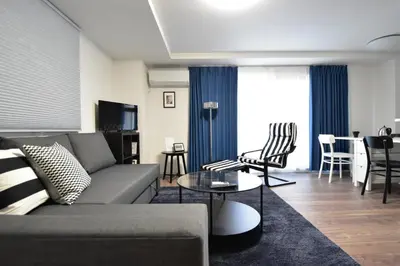 a living room with a couch and a table at LANG - Vacation STAY 22195v in Tokyo