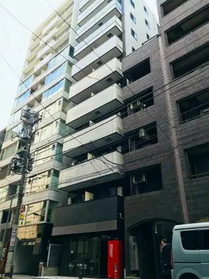 a tall building on a city street with a van at LANG - Vacation STAY 22195v in Tokyo