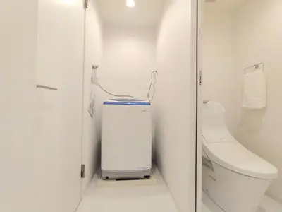 a white bathroom with a toilet and a sink at LANG - Vacation STAY 22195v in Tokyo