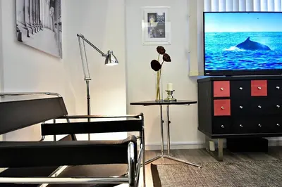 a living room with a television on a dresser at LANG - Vacation STAY 22203v in Tokyo
