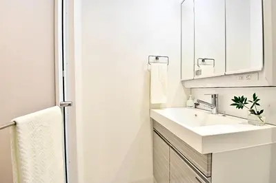 a bathroom with a sink and a mirror at LANG - Vacation STAY 22203v in Tokyo