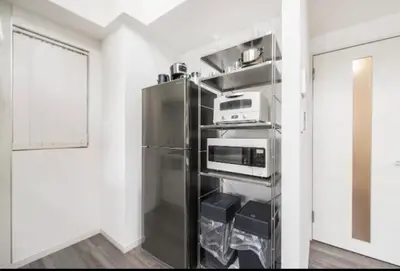 a kitchen with a refrigerator and a microwave at LANG - Vacation STAY 22203v in Tokyo