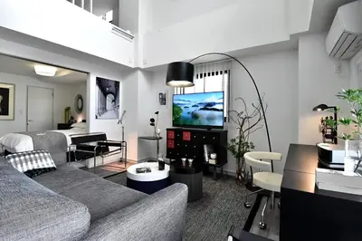 a living room with a couch and a tv at LANG - Vacation STAY 22203v in Tokyo