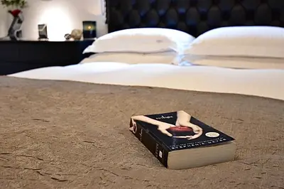 a book with a doll on top of it on a bed at LANG - Vacation STAY 22203v in Tokyo