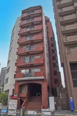 a tall building with a staircase in front of it at Hotel \u7c8bSUI Shinjuku in Tokyo