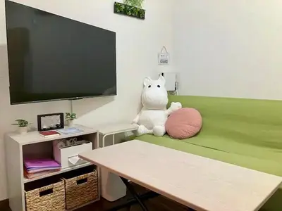 a stuffed animal sitting on a table with a tv at Direct access to major Tokyo stations including Shibuya, Shinjuku, Ikebukuro, Akihabara, and Ueno 3-minute walk from nearest station Tokyo Dome Suitable for long-term stays 201 in Tokyo
