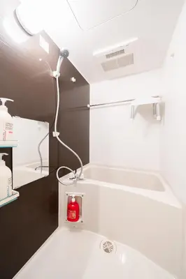 a bathroom with a sink with a red bottle on it at Direct access to major Tokyo stations including Shibuya, Shinjuku, Ikebukuro, Akihabara, and Ueno 3-minute walk from nearest station Tokyo Dome Suitable for long-term stays 201 in Tokyo