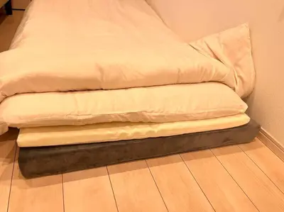 a bed sitting on top of a wooden floor at Miu Hotel Shinagawa - Tokyo Travel Hub near Landmarks, Bullet Train & Airport in Tokyo