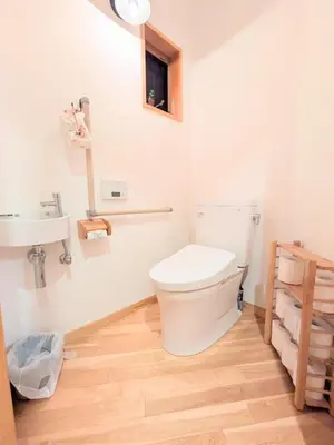 a bathroom with a toilet and a sink at Asukayama Forrest in Tokyo