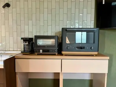 two appliances sitting on top of a table at Rakuna Inn \u967d Sasazuka2 in Tokyo