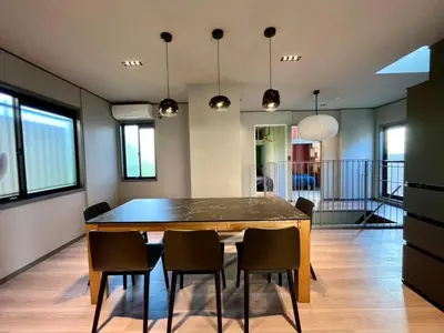 a dining room with a table and chairs at Rakuna Inn \u967d Sasazuka2 in Tokyo