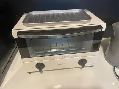 a toaster oven sitting on top of a counter at Tommy's house 東京都内では貴重な無料駐車場付で大地震でも安心の新しい家 in Tokyo