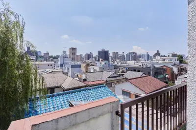 a view of a city with buildings and roofs at HATa in Tokyo