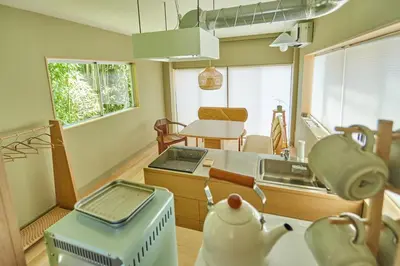 a kitchen with a stove and a sink in it at HATa in Tokyo