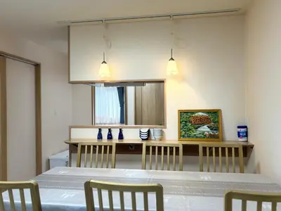 a kitchen with a table and chairs in a room at Lapis House 201 - 2F in Tokyo