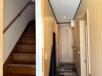 a hallway with stairs in a house at Lapis House 201 - 2F in Tokyo