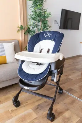 a blue and white chair with a table in a living room at Shinjuku-ku - House - Vacation STAY 17230 in Tokyo