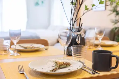 a table with a plate of food and wine glasses at Shinjuku-ku - House - Vacation STAY 17230 in Tokyo