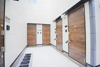 a row of doors in a hallway in a building at #41 -Japanese-Retreat Inn- \u5800\u5207 in Tokyo