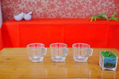 three empty glasses on a table with a red table cloth at #41 -Japanese-Retreat Inn- \u5800\u5207 in Tokyo