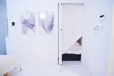 a bedroom with a sliding door with a bed at #41 -Japanese-Retreat Inn- \u5800\u5207 in Tokyo