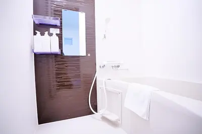 a bathroom with a white tub and a sink at #41 -Japanese-Retreat Inn- \u5800\u5207 in Tokyo