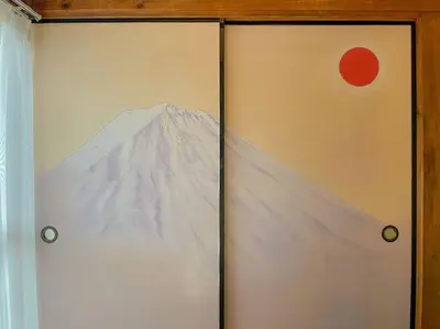 a door with a painting of a mountain on it at SUSHI STAY tokyo in Tokyo