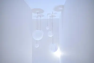 a group of lights hanging from a ceiling at Nordic-Retreat Inn in Tokyo