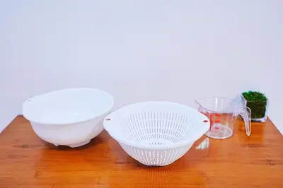 two white bowls sitting on a wooden table at Nordic-Retreat Inn in Tokyo