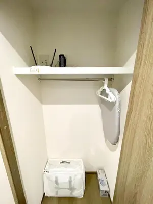 a small bathroom with a toilet and a shelf at Kita-Ueno Inn - Near UENO, ASAKUSA, SENSOJI, TOKYO SKY TREE - Self check-in in Tokyo