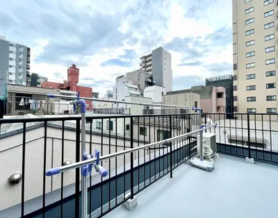 a balcony with a view of a city at Kita-Ueno Inn - Near UENO, ASAKUSA, SENSOJI, TOKYO SKY TREE - Self check-in in Tokyo