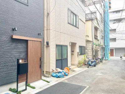 a building with a door on the side of a street at Kita-Ueno Inn - Near UENO, ASAKUSA, SENSOJI, TOKYO SKY TREE - Self check-in in Tokyo