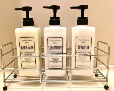 three bottles of soap on a rack in a bathroom at S,F, Heights - Vacation STAY 17170 in Tokyo