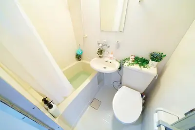 a small bathroom with a toilet and a sink at SC 206 Cozy Private Stay with Loft Near Station Free WiFi in Tokyo