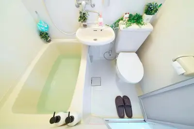 a bathroom with a toilet and a sink at SC 206 Cozy Private Stay with Loft Near Station Free WiFi in Tokyo