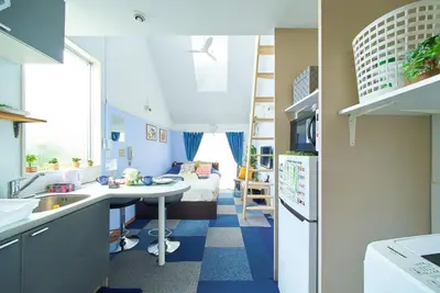 a small room with a kitchen and a living room at SC 206 Cozy Private Stay with Loft Near Station Free WiFi in Tokyo
