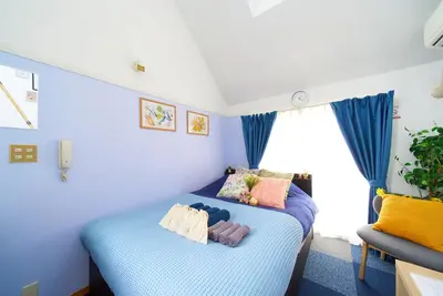 a bedroom with two beds and a window at SC 206 Cozy Private Stay with Loft Near Station Free WiFi in Tokyo