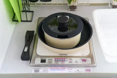 a food processor sitting on a counter next to a knife at SC 206 Cozy Private Stay with Loft Near Station Free WiFi in Tokyo