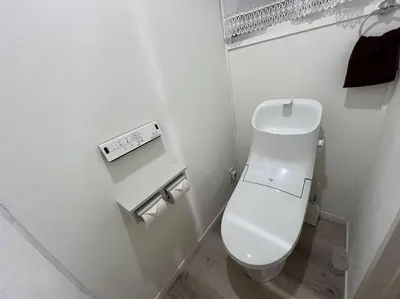 a bathroom with a white toilet in a room at Cozy inn \u897f\u54c1\u5ddd101 in Tokyo