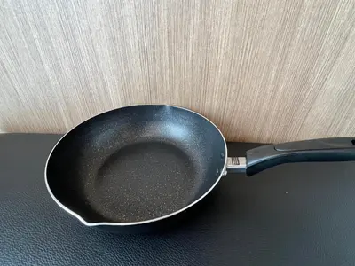 a frying pan sitting on top of a table at Cozy inn \u897f\u54c1\u5ddd101 in Tokyo
